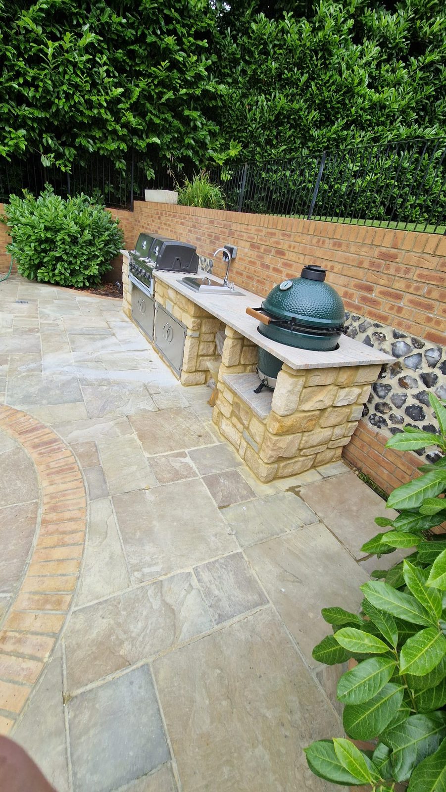 Outdoor kitchen with Big Green Egg and stone worktop